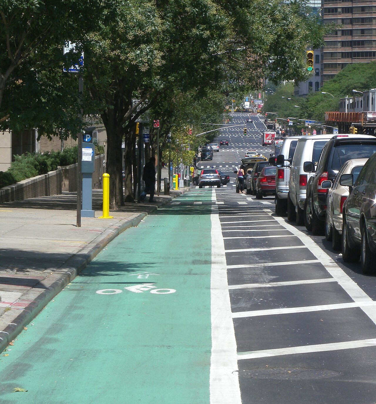 Protected bike lane with striped "buffer zone".