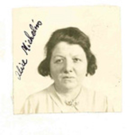 Alice Michelin’s 1943 naturalization photograph: a woman with short dark hair in a white shirt.