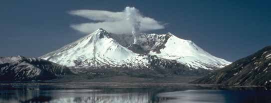 Mount St. Helens in 1982, its top blown away into a broad crater, above Spirit Lake.