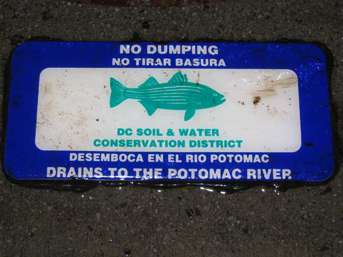 Many municipalities that border the Potomac River are painting words like "Drains to the Potomac" across their storm drains.