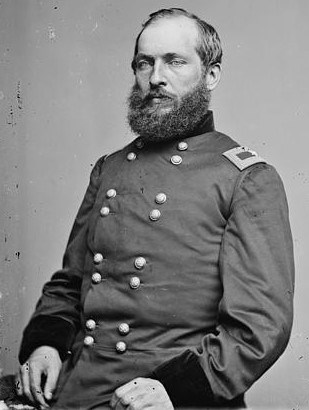 James A. Garfield, seated, in military uniform.