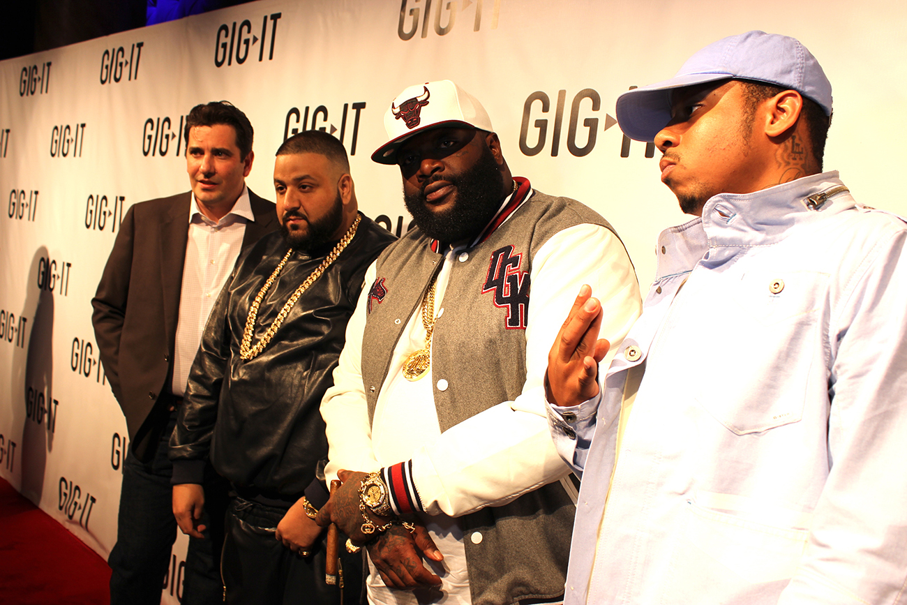 A photograph shows D J Khaled posing for a photo op with Rick Ross.