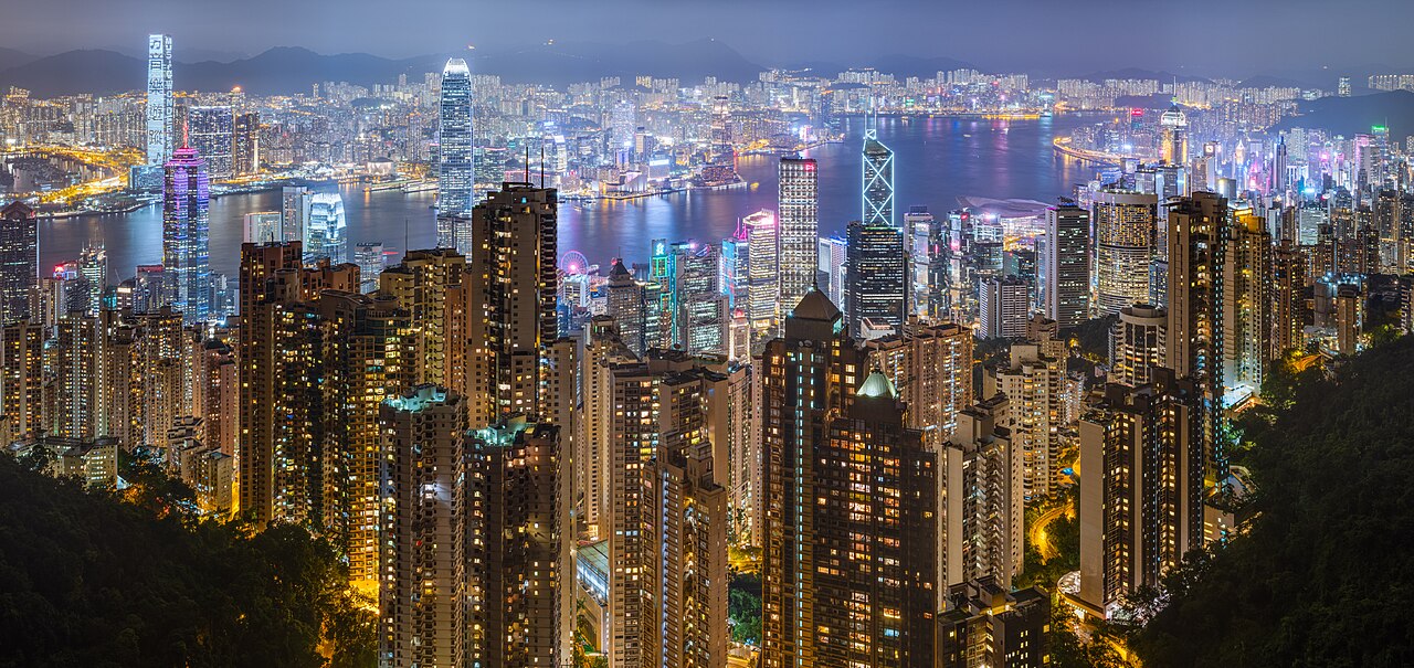 "The Pearl of the Orient's" vibrant, luminous skyline at night.