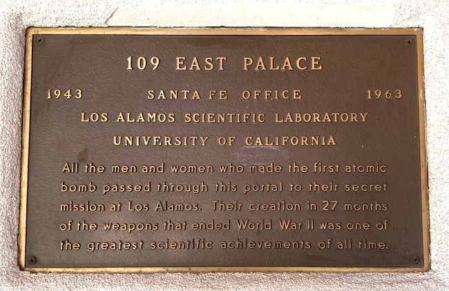 Bronze plaque reading in part 109 East Palace, 1943 Santa Fe Office 1963, Los Alamos Scientific Laboratory, University of California