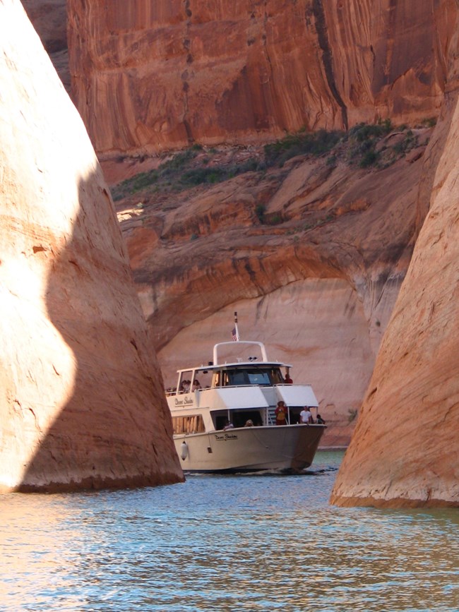 A tour boat entering the narrow Rainbow Bridge canyon.