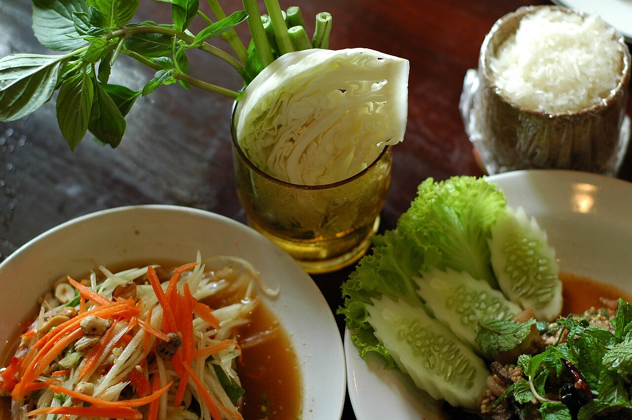 A classic Isaan meal: som tam papaya salad, larb meat salad and sticky rice