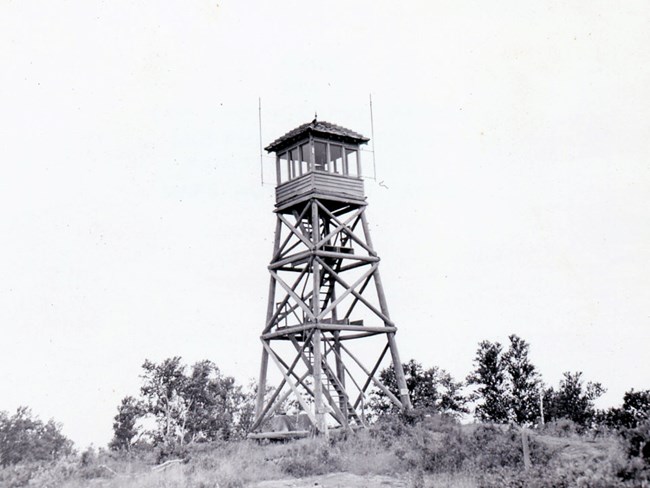 Historic photo of the original timber Ojibway fire tower.