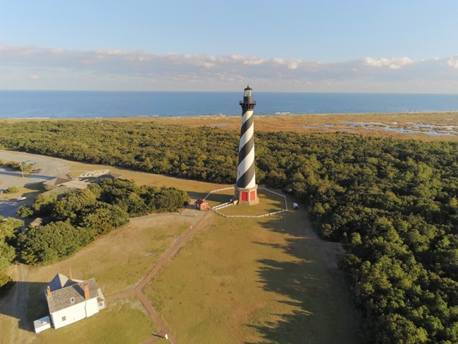 Aerial view of the Cape Hatteras Lighthouse and its grounds before restoration.