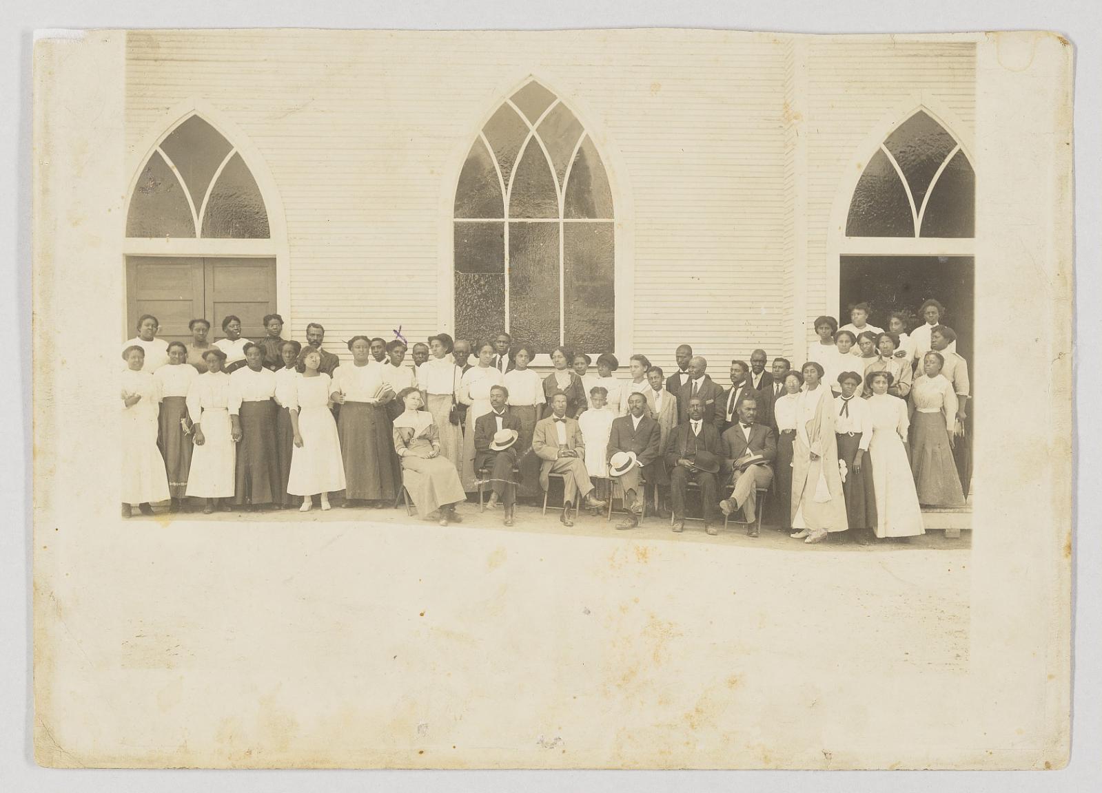 Photographic print of men and women in front of Vernon AME Church, Tulsa
