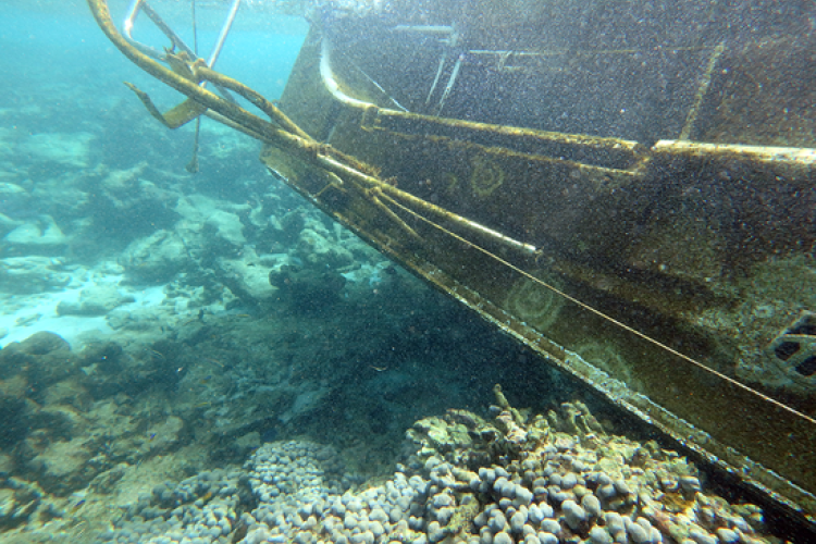 Underwater view of a stranded boat