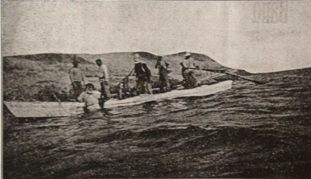 A crew in a boat running a hardhat diving operation