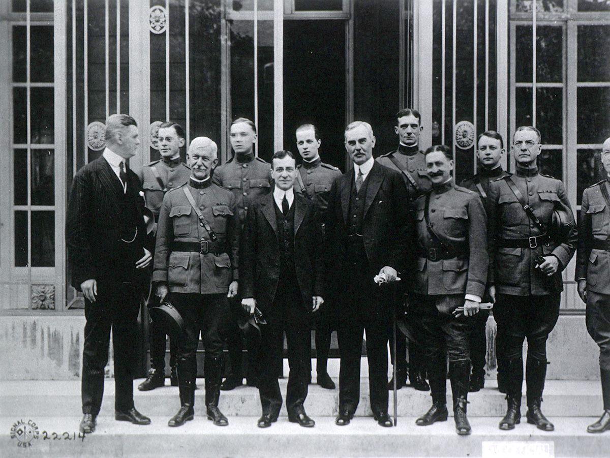 Photograph of group of men standing.
