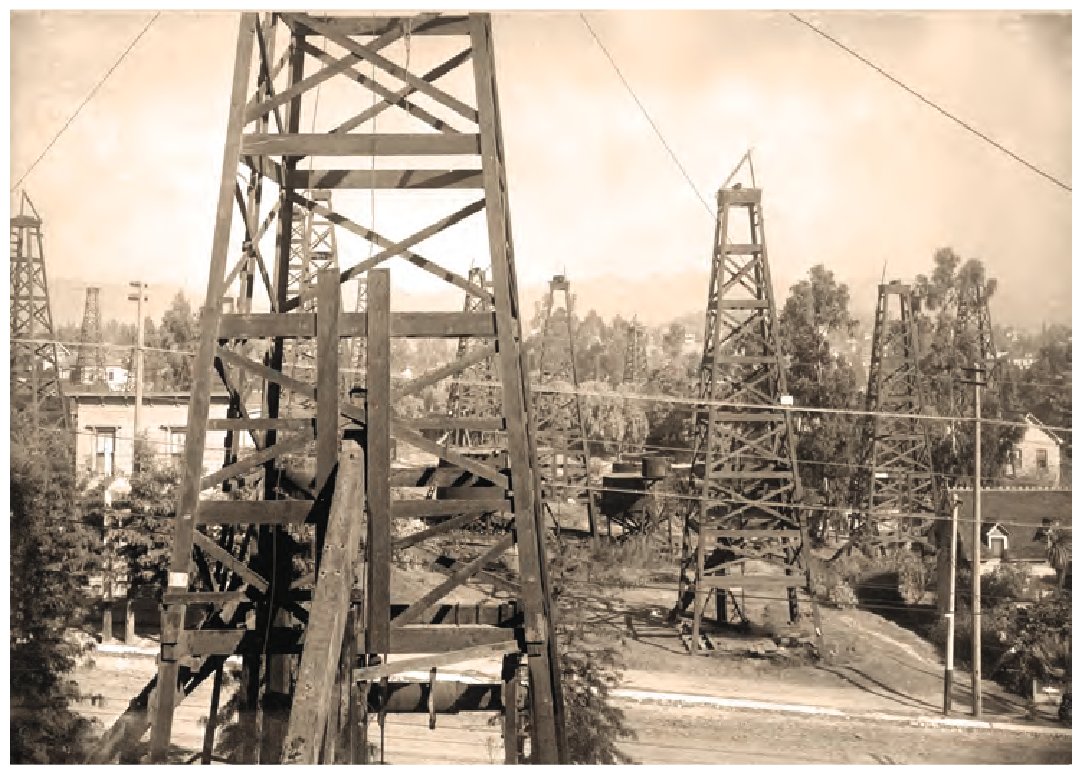 Oil derricks and houses in central Los Angeles, 1905. USGS photo by Ralph Arnold.