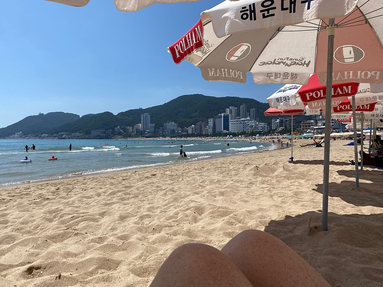 Relaxing on Songjeong beach in summer