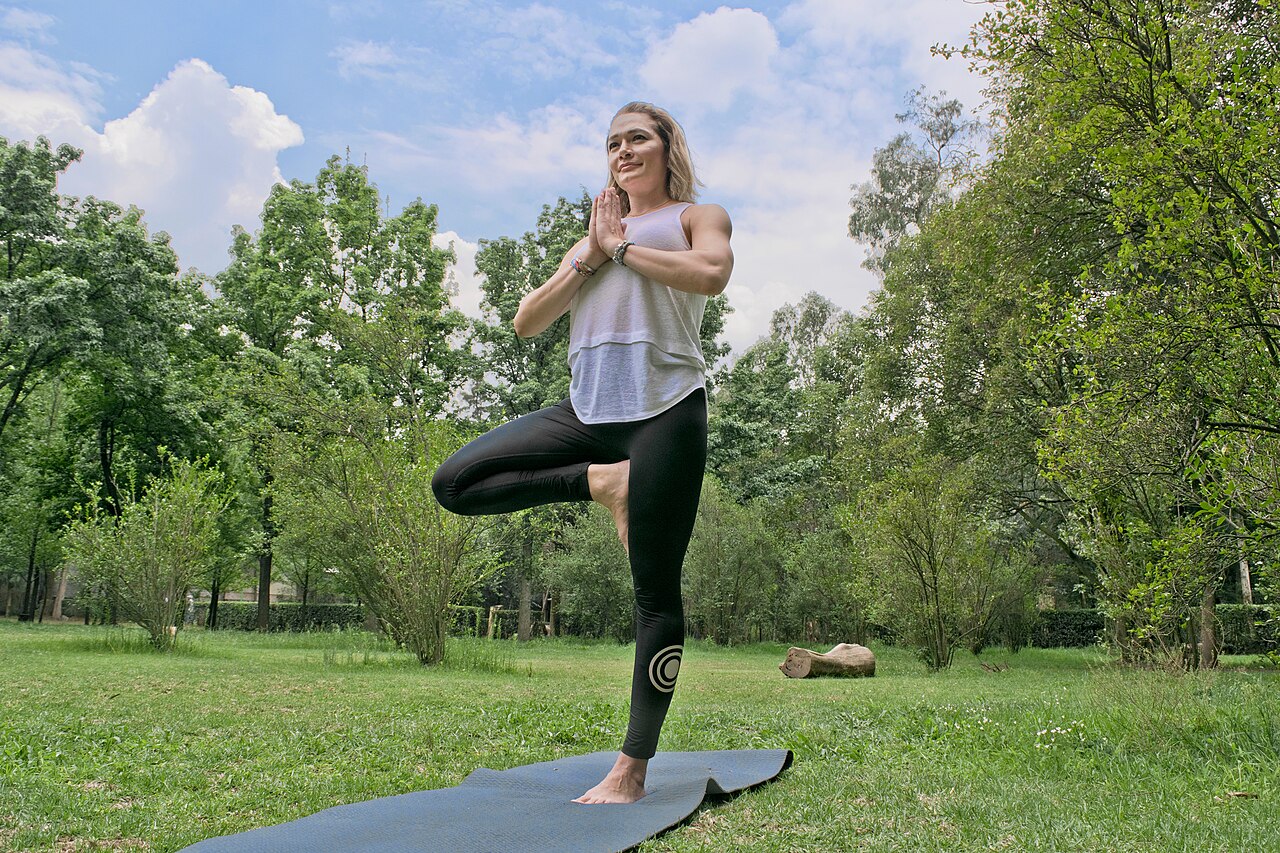 Woman demonstrating 'Tree Pose' during yoga session