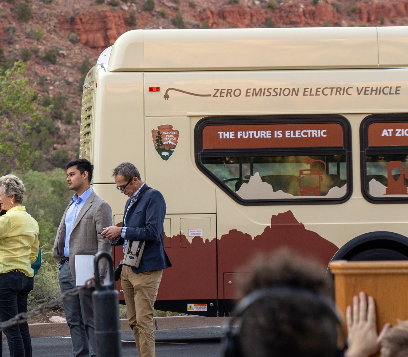 The back of a Zion shuttle bus reading "Zero Emission Electric Vehicle" and "The future is electric".