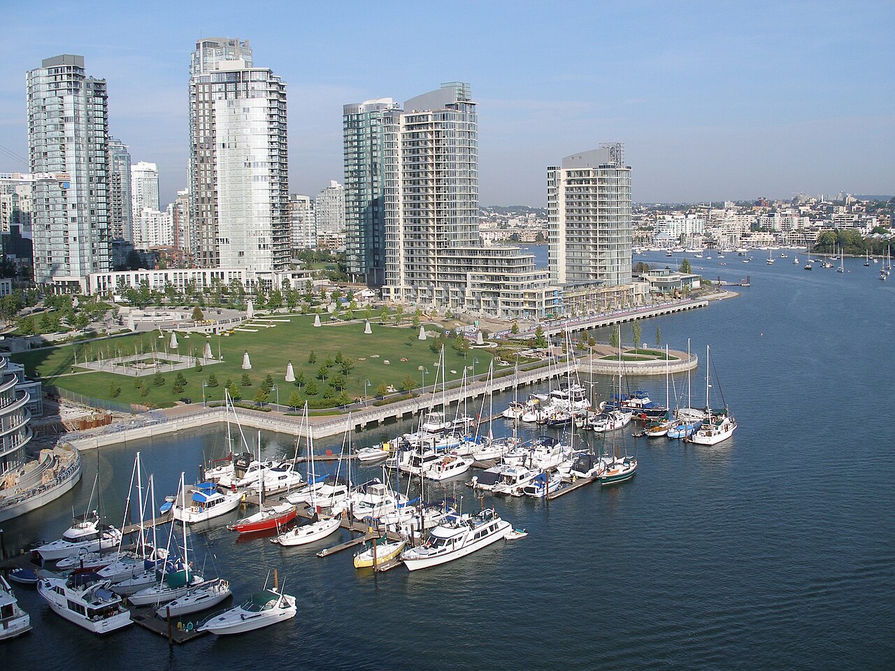 Tall, thin buildings overlooking a Vancouver marina.