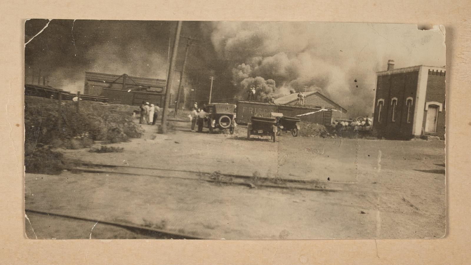 Photograph of the Greenwood District burning during the Tulsa Race Massacre